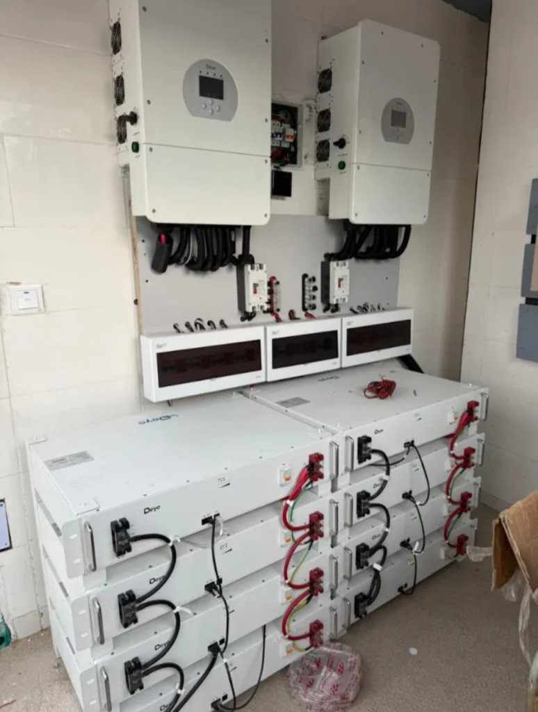 Two Deye hybrid inverters above stacked Deye lithium battery modules