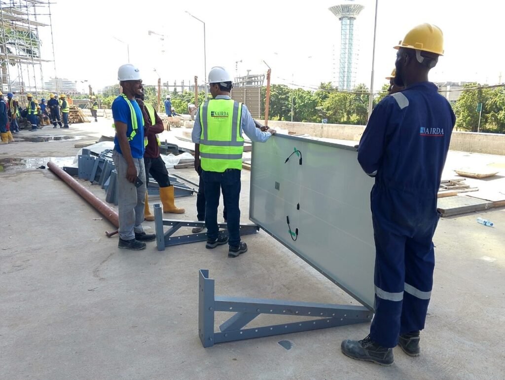Crew handling a mounting frame into position on site