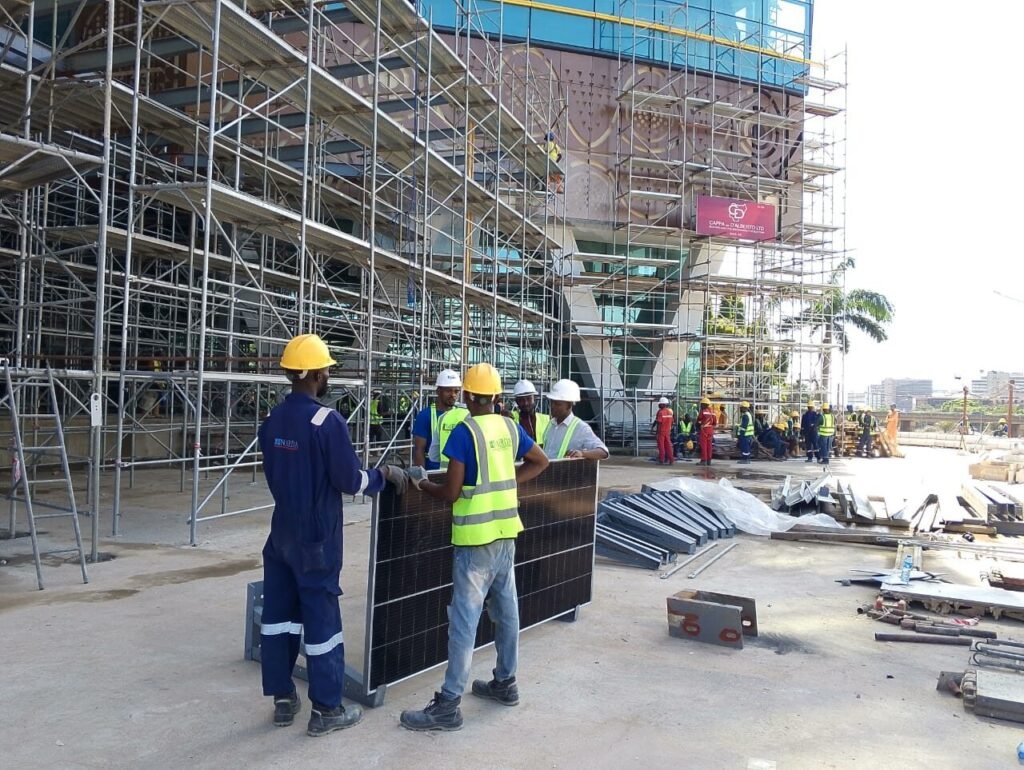 Crew in hi-vis working at the base of the scaffolding run