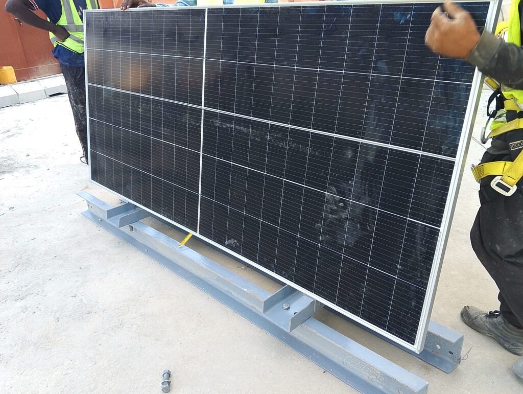 A solar module set down on its rails ready to be fixed