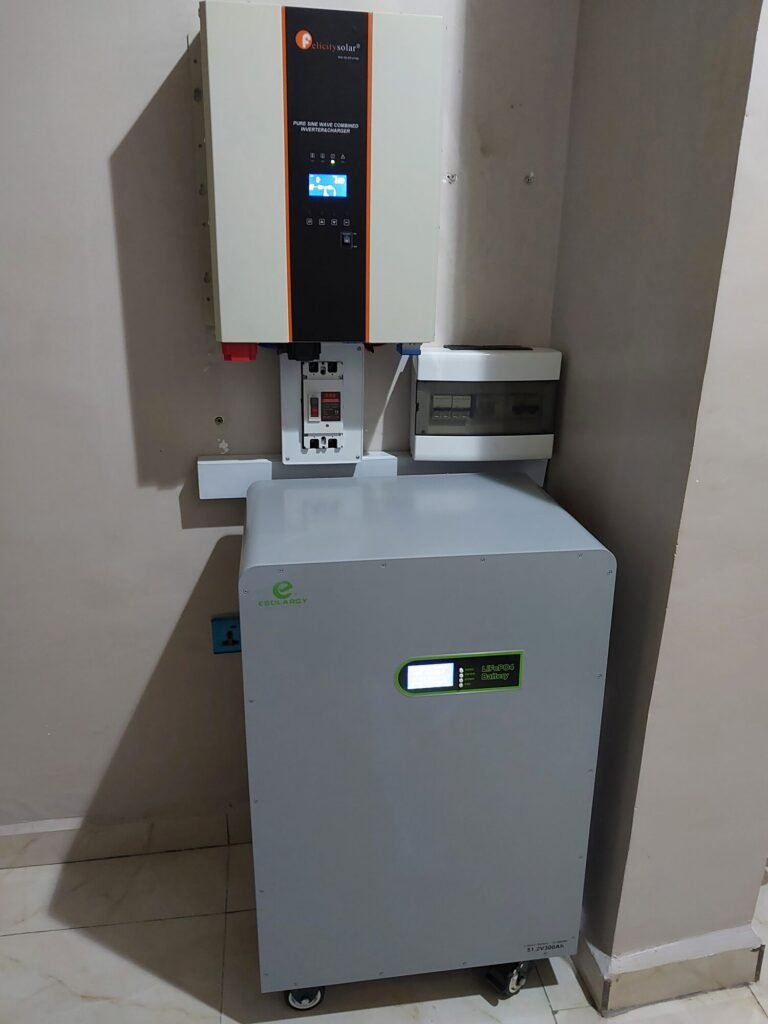 Wall-mounted hybrid inverter above a floor-standing lithium battery unit
